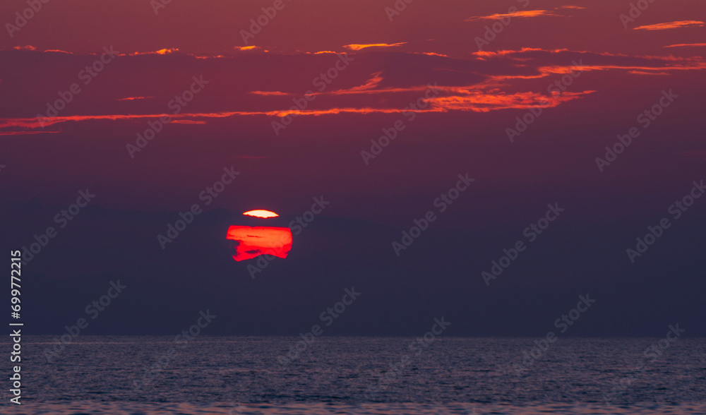 Colourful sunset from the beach on the Cassandra peninsula on the Aegean Sea in Greece Colourful sunset from the beach on the Cassandra peninsula on the Aegean Sea in Greece