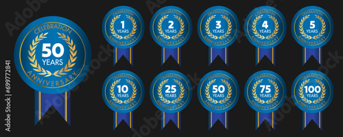 Set of anniversary gold badges and labels. In blue design.