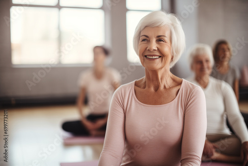 An elderly woman participating in a group yoga session