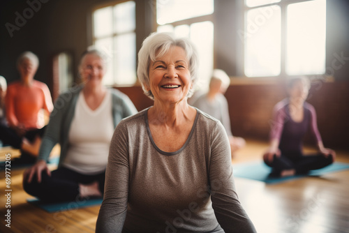 Elderly woman participating in a group yoga session