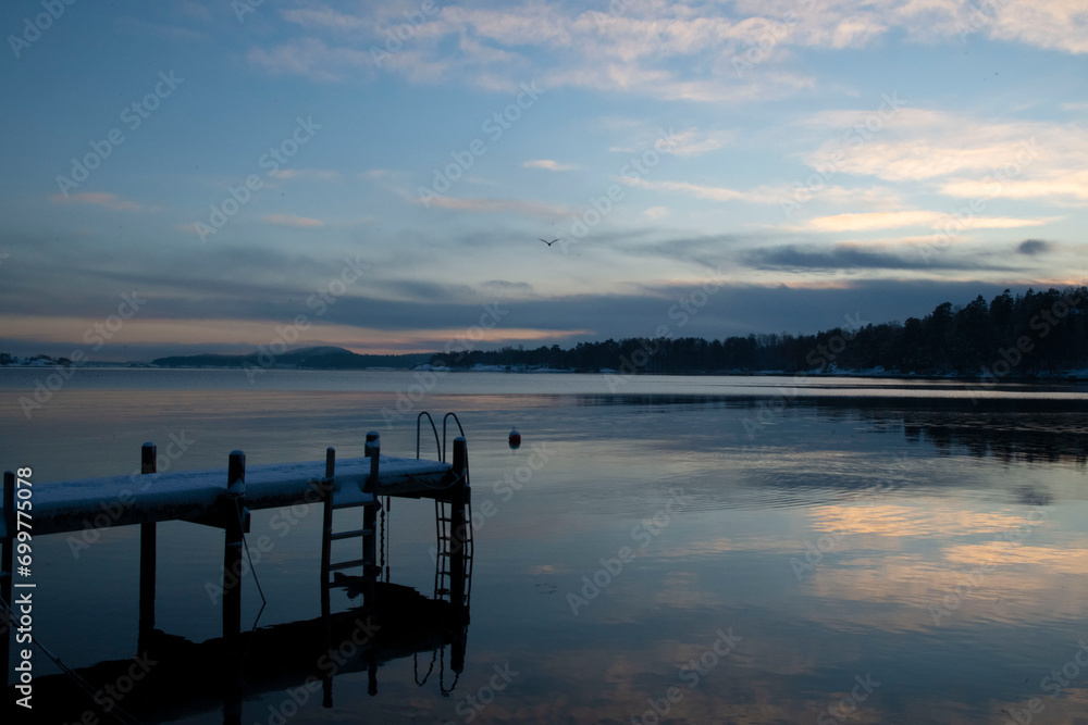 Fototapeta premium sunset on the lake in winter
