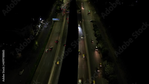Drone shot of a road with moving traffic

