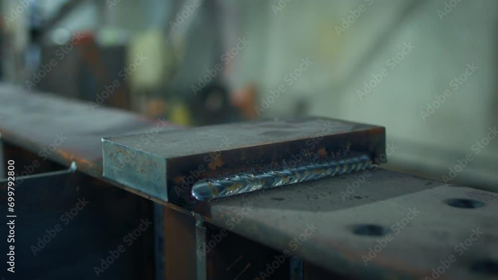 Taking details in the industrial metal enterprise capturing the piece of welding material after the blacksmith ends the work Taking details in the industrial metal enterprise capturing the piece of welding material after the blacksmith ends the work
