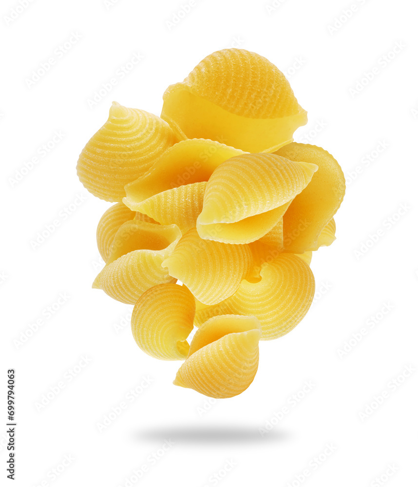 Heap of uncooked shell pasta in the air close up on a white background Heap of uncooked shell pasta in the air close up on a white background