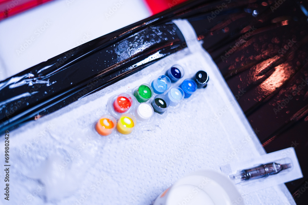 Colorful tattoo inks in the tattoo studio.