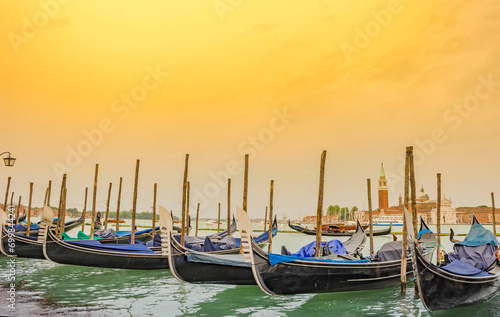 Obraz na płótnie Gondolas near Saint Mark Square (Piazza San Marco) and church of San Giorgio di Maggiore in the background, in Venice, Italy, at sunrise w salonie