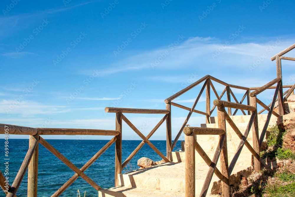 Wooden railings against the background of the sea. Seascape