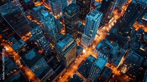 Aerial city view at night, illuminated streets, urban landscape, skyline.