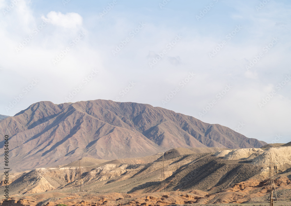 Fototapeta premium High voltage power lines in the rusty mountains