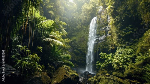 Fototapeta Naklejka Na Ścianę i Meble -  Majestic waterfall cascading through a lush tropical rainforest