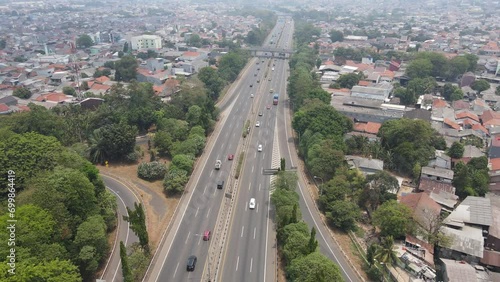 Aerial view of toll road that surrounded by residential area in Cakung, East Jakarta, Indonesia photo