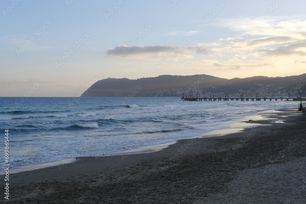 The Italian shore at the end of the day. Alassio, Italy - December 23, 2023.
