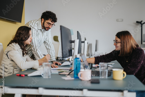 Business professionals collaborate and strategize for profit growth in a creative office. Teamwork and success are evident as they discuss reports and brainstorm ideas.