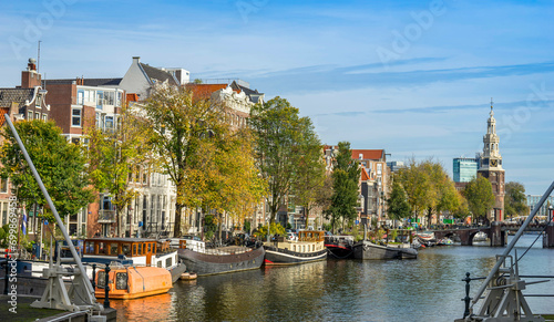 Channel in Amsterdam Netherlands houses river Amstel landmark old european city spring landscape. #699869458
