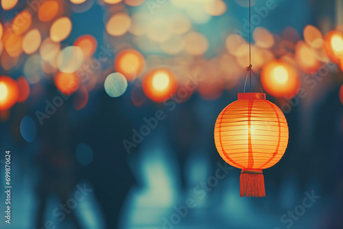 Festive decorative background of red lanterns decorating the streets with blurred people in the background, during Chinese New Year.
