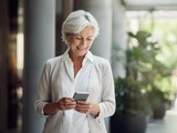 Senior Woman Smiling and Looking at Smart Phone