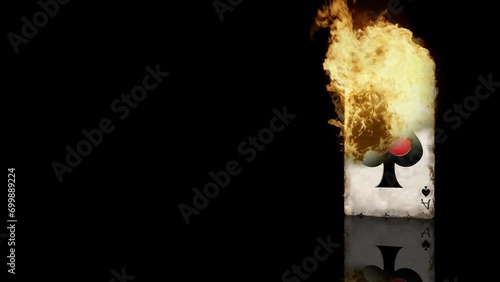 Flaming Ace of Spades Card with Reflection 4K Loop features a worn ace of spades playing card standing up a black reflective surface on fire in a loop. photo