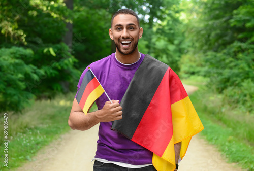 Young man with flags of Ger...