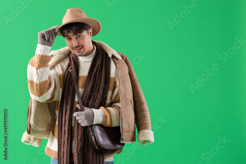 Young man in winter clothes...