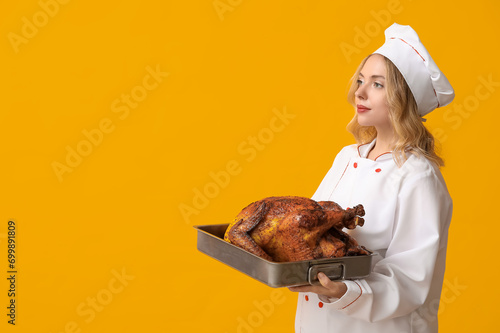 Young female chef with tast...