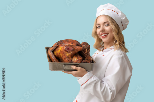 Young female chef with tast...