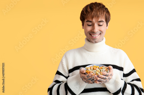 Man holding bowl with cerea...