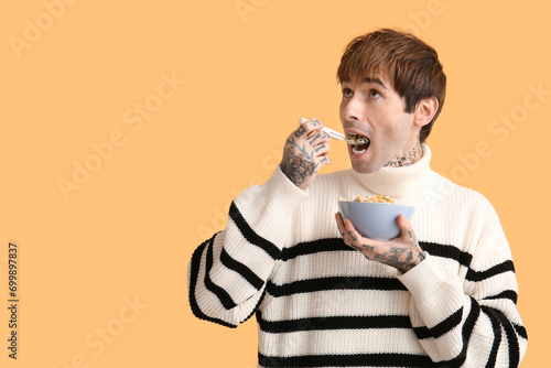 Man eating cereal rings on ...