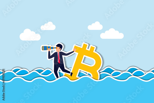 Bitcoin price down, future of crypto currency price or vision to see cryptocurrency market concept, businessman investor standing on drowning bitcoin symbol using telescope to see future.