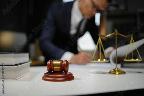 Partner lawyers or attorneys discussing a contract agreement. Successful businessmen have a contract in place to protect it,signing of modest agreements form in office...