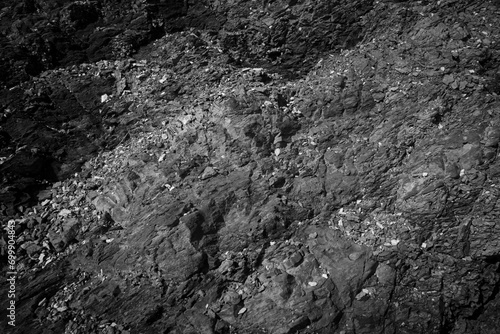Weathered stone background. Black weathered rock.