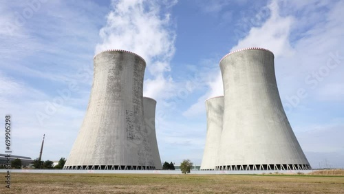 Low angle view of Nuclear power plant Dukovany cooling tower vapor emission photo