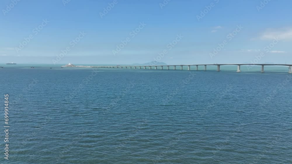 Aerial drone skyview of Hong Kong-Zhuhai-Macao Bridge at Chek Lap Kok Lantau Island near Tung Chung Tuen Min,is the longest bridge-cum-tunnel sea crossing in the world Aerial drone skyview of Hong Kong-Zhuhai-Macao Bridge at Chek Lap Kok Lantau Island near Tung Chung Tuen Min,is the longest bridge-cum-tunnel sea crossing in the world