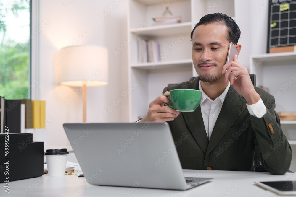Close up of happy smile businessman holding smartphone in office for online chat message communication. Using mobile phone in workplace electronic transactions, shopping online. Focus at mobilephone. Close up of happy smile businessman holding smartphone in office for online chat message communication. Using mobile phone in workplace electronic transactions, shopping online. Focus at mobilephone.