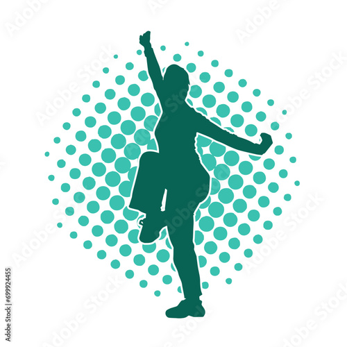Silhouette of a woman in oriental martial art pose. Silhouette of a female in martial art move.