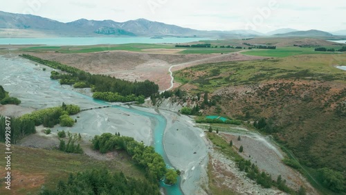 Cass River New Zealand bridge with Lake Tekapo in the background with mountians photo