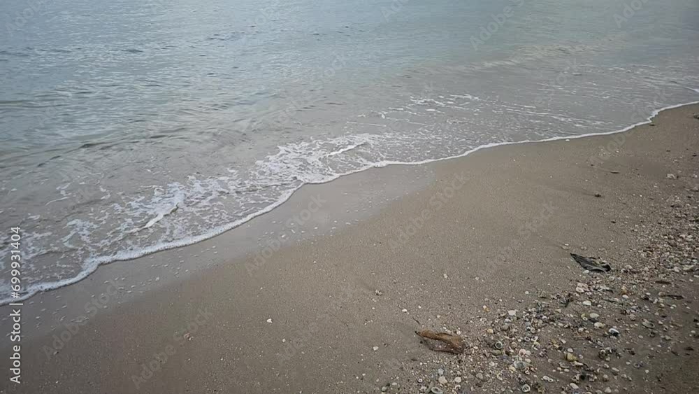 waves crashing on a sandy beach waves crashing on a sandy beach