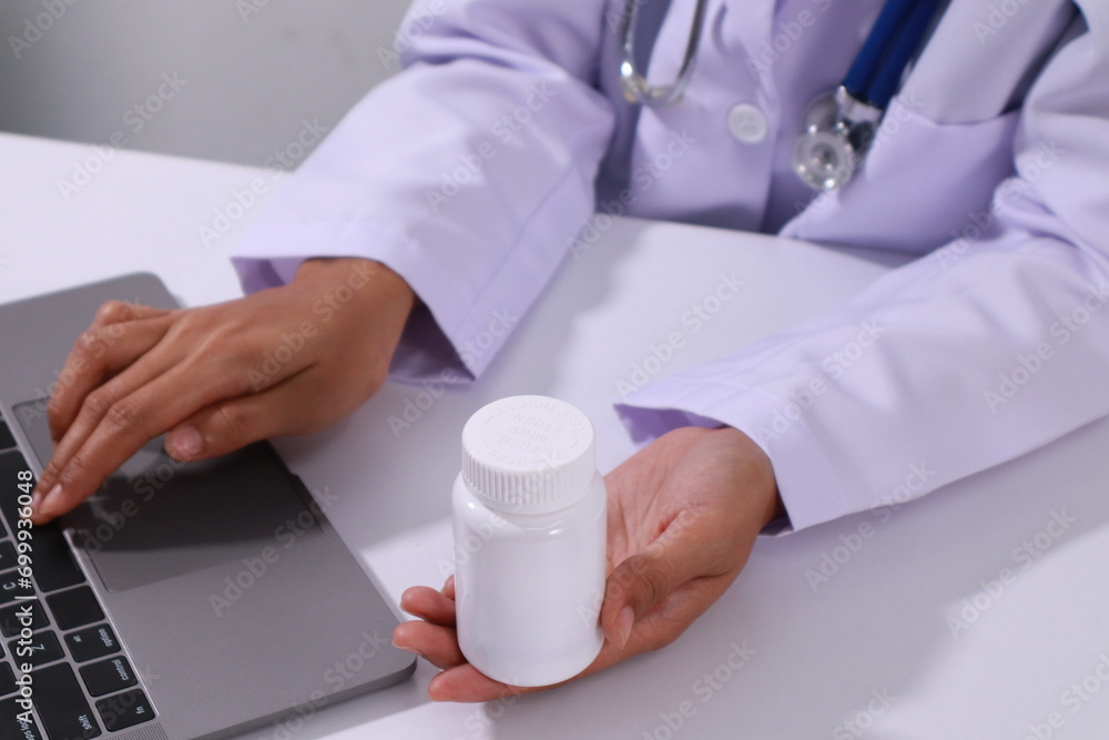 Close up of the ears of a professional female doctor in uniform taking notes in a notebook Medical therapist filling out medical documents. Clipboard. Patient form. Illness history, prescription Close up of the ears of a professional female doctor in uniform taking notes in a notebook Medical therapist filling out medical documents. Clipboard. Patient form. Illness history, prescription