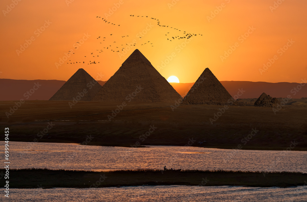 Giza pyramid Complex in Aswan city by the Nile at amazing sunset - Egypt