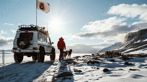 Two strong man with red expedition uniform holding siberian husky,stand aside mercedes g65,Hills with thick snow photo