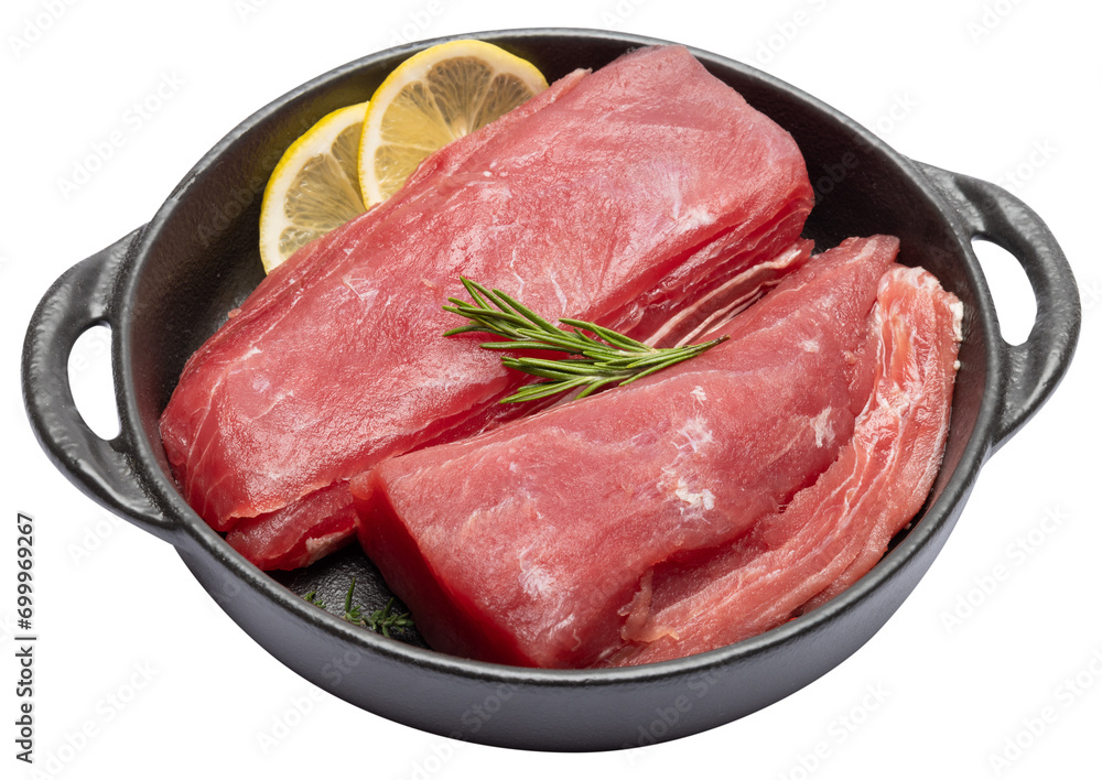 Fresh tuna Fish steak in a black ceramic dish isolated