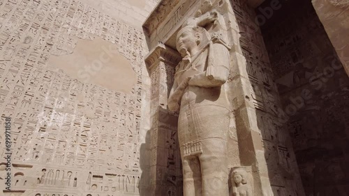 Wallpaper Mural Luxor, Egypt - November 26 2023: The Ramessid columns in the peristyle court of the famous temple of Ramesses III in Medinet Habu on Luxor near the Valley of Kings in upper Egypt.  Torontodigital.ca