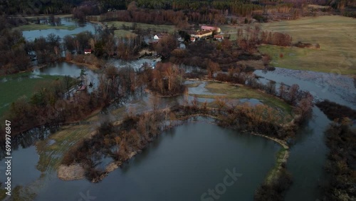 A flooded landscape with an old settlement. Drone. Spiled water. Europe. photo