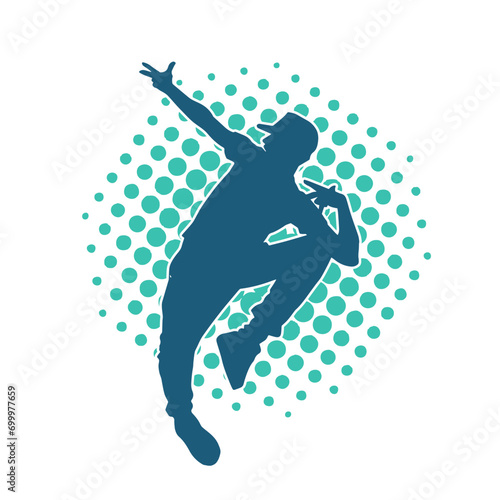 Silhouette of a slim man dancing pose. Silhouette of a male dancer in action pose.