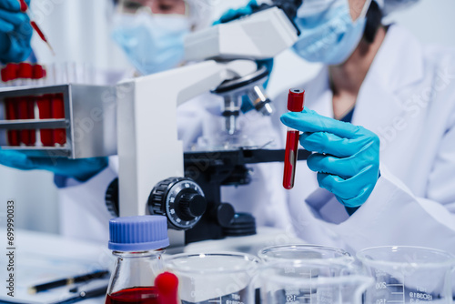 Obraz na płótnie Professional scientists in lab working with blood samples