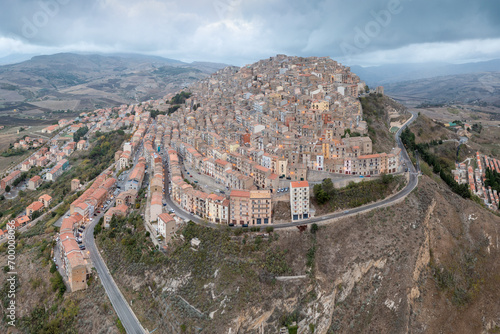 Vászonkép The stunning village of Gangi with Mount Etna volcano at its back in Sicily, Italy