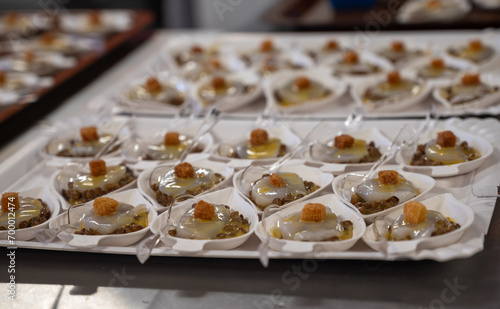 Degustation appetisers for visitors made by great chefs of high cuisine French restaurants, winter festival, Avenue de Champagne, Epernay, France © barmalini
