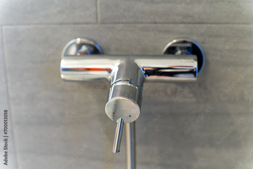 Bathroom of apartment building with close-up shower mixer at Swiss City of Zürich. Photo taken December 29th, 2023, Zurich, Switzerland. Bathroom of apartment building with close-up shower mixer at Swiss City of Zürich. Photo taken December 29th, 2023, Zurich, Switzerland.