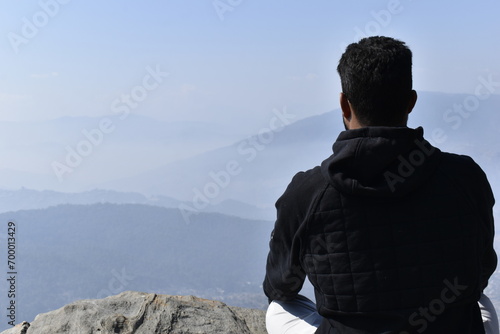 person on the top of the mountain