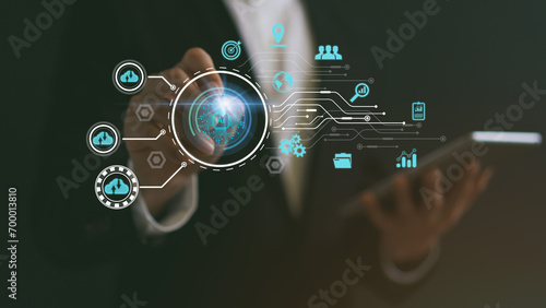 Businessman using stylus on hologram. AI analyze and visualize complex information on a virtual screen using AI to process data. Big data technology  Data flow  Artificial intelligence.