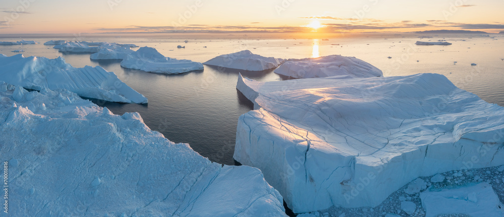 Melting icebergs by the coast of Greenland, on a beautiful summer day - Melting of a iceberg and pouring water into the sea. Global warming
Arctic nature landscape, Summer day - obrazy, fototapety, plakaty 
